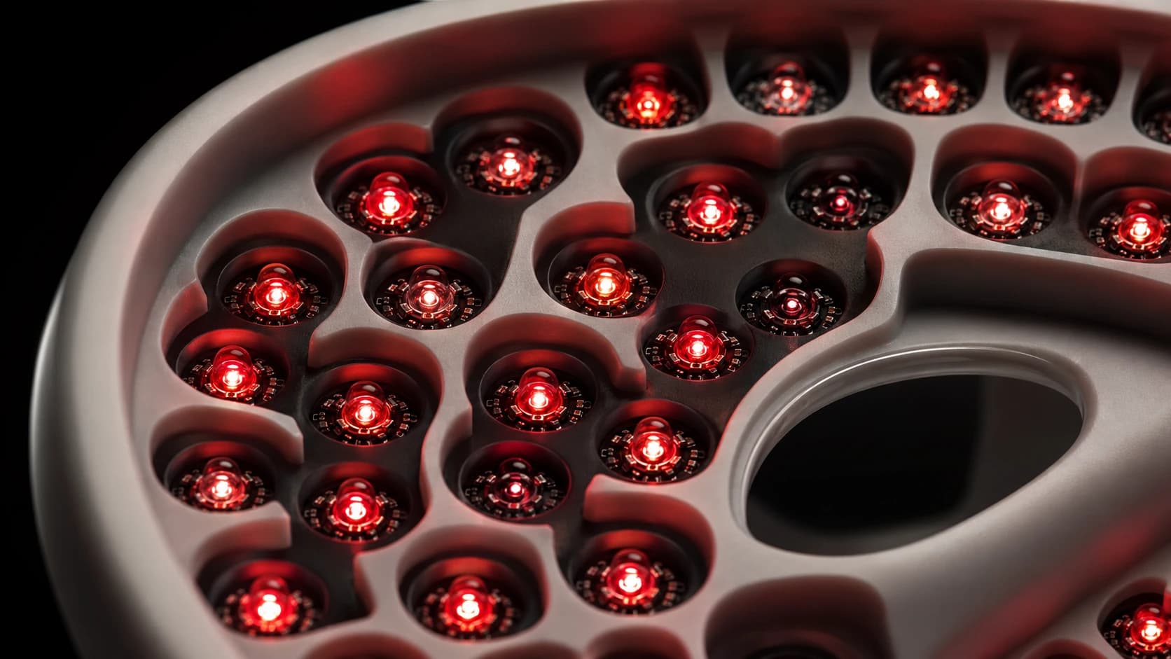 Macro view of the LED array inside an unbranded therapy mask, with individual diodes visible